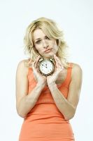 portrait-of-a-blonde-woman-holding-an-alarm-clock-7