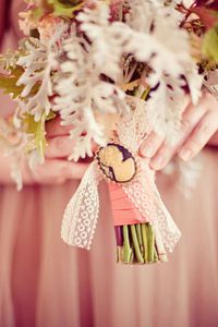 flower-bouquet-wrapped-in-lace-and-cameo-brooch.jpg