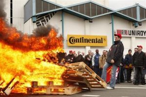 employees-at-continental-factory-stand-around-a-bonfire-as-.jpg