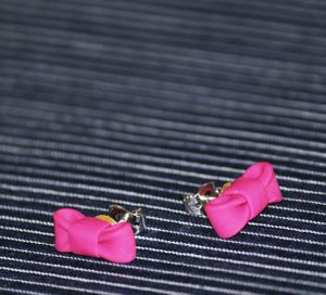 Boucles d'oreille noeud rose 04