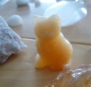 calcite orange chat figurine