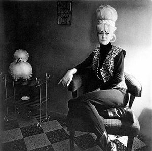 Arbus-Lady-bartender-at-home-with-a-souvenir-dog1964.jpg
