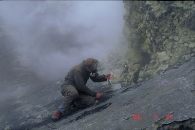 Akutan - CVO collecting gas samples in the crater - G.McGim