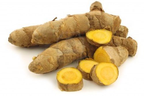 15107557-turmeric-curcuma-longa-root-and-some-cut-pieces-on.jpg