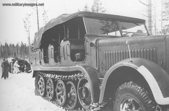 WWII - Sd Kfz 7 tows a field howitzer using the winch