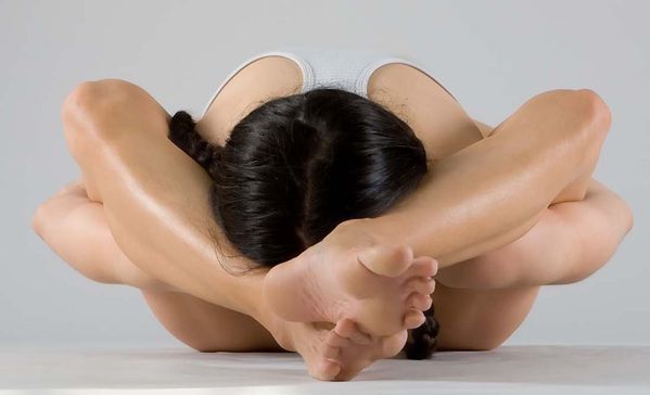 Yoga-Tortoise-Pose-Legs-Behind-Head-in-Forward-Fold-Kurmasa.jpg