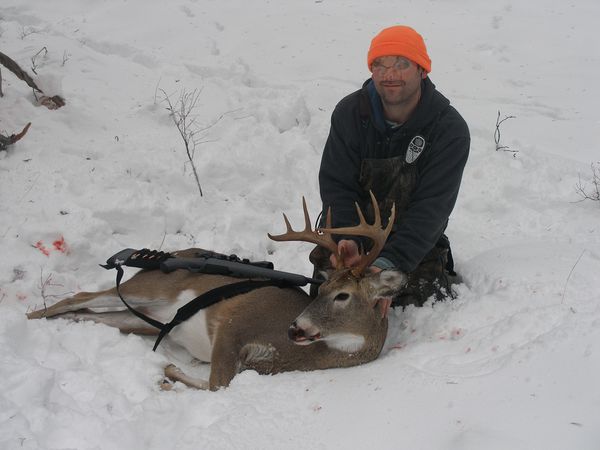 Hunter with buck