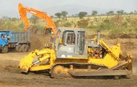 machinery-upgrading-road-for-sugar-plantations-near-hana-bo