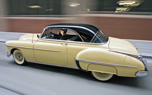 c12_0612_03z-1950_oldsmobile_futuramic_88-rear_side_driving.jpg