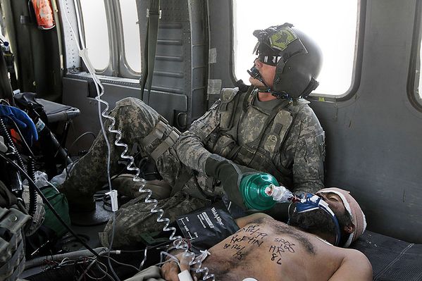 Army Cpl. Samuel Bard helped a wounded Afghan